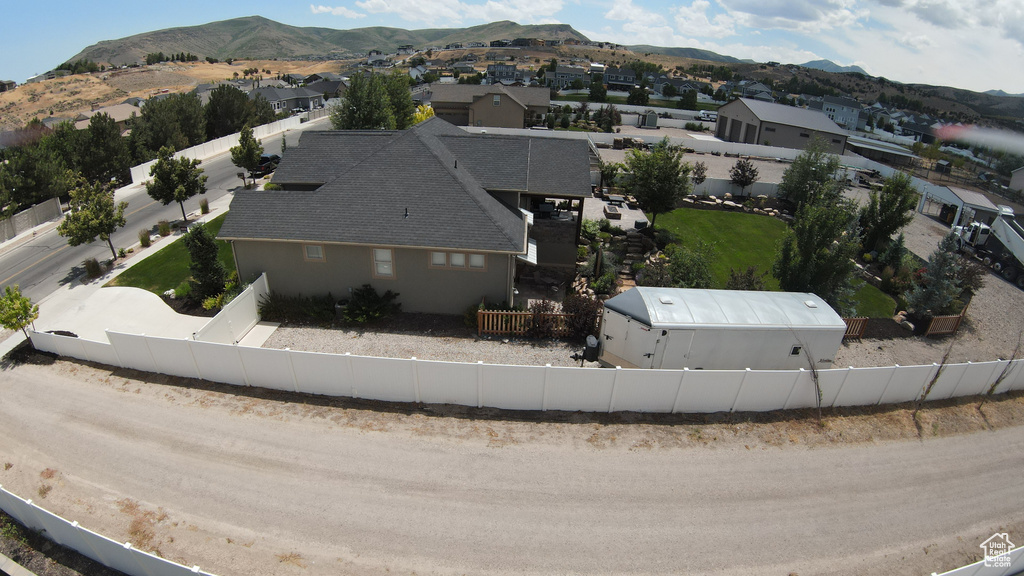 Aerial view of residential area featuring a mountain backdrop