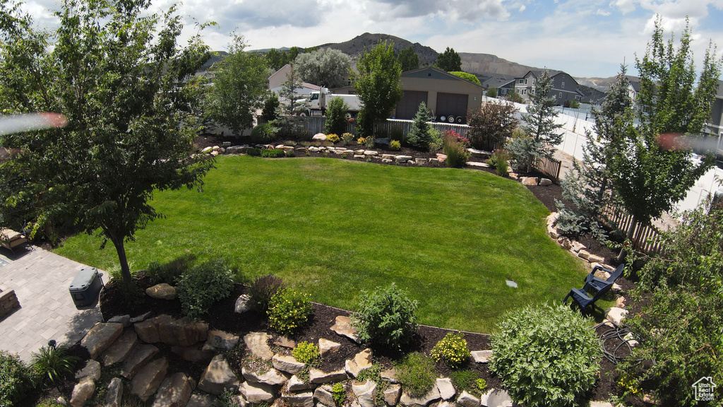 View of yard featuring a residential view and a mountain view