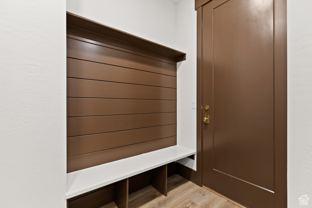 Mudroom featuring light wood finished floors