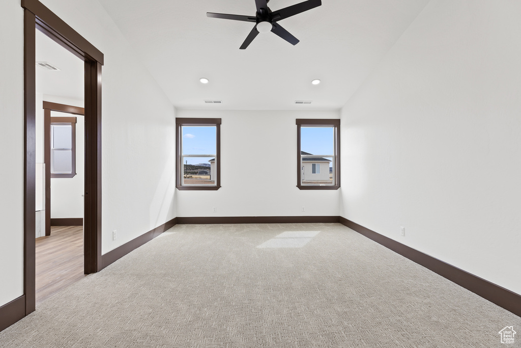 Unfurnished room featuring recessed lighting, ceiling fan, baseboards, and carpet floors