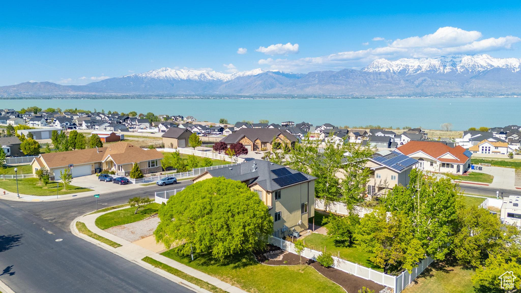 Birds eye view of property with a residential view and a water and mountain view