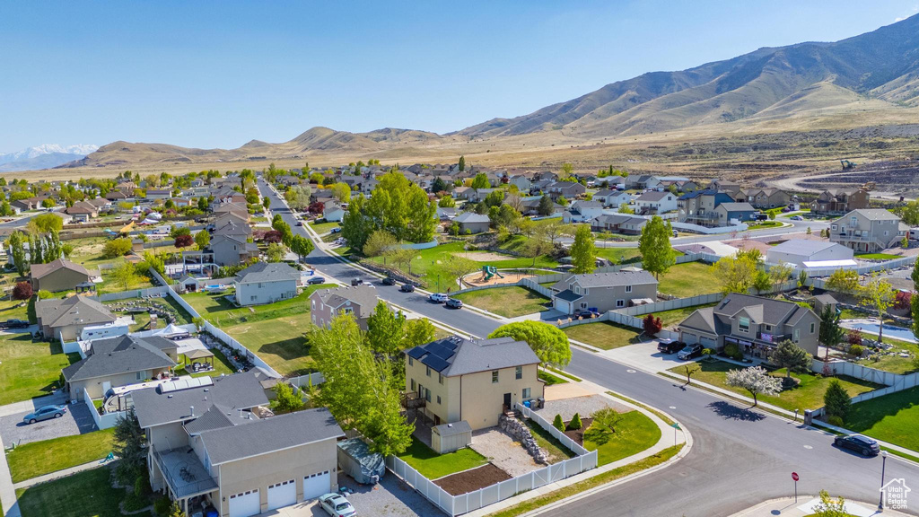 Drone / aerial view featuring a mountain view and a residential view