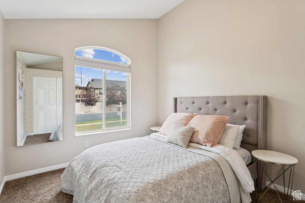 Bedroom featuring baseboards and carpet flooring