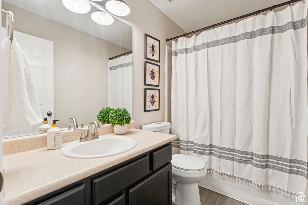 Bathroom featuring vanity and wood finished floors