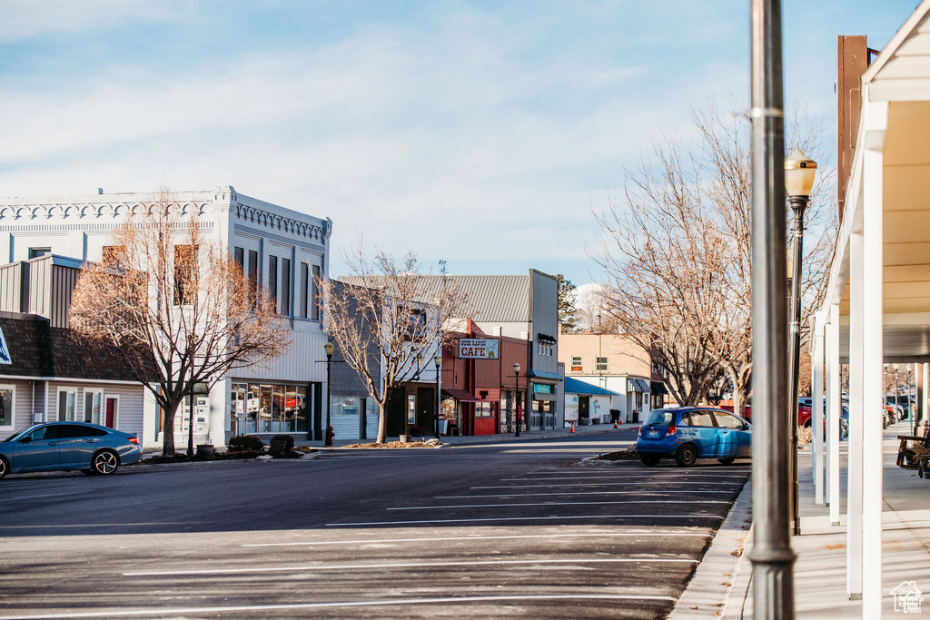 View of road with curbs, street lighting, and sidewalks