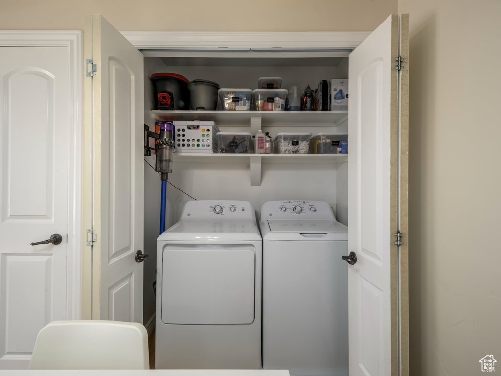 Laundry room featuring laundry area and washer and clothes dryer