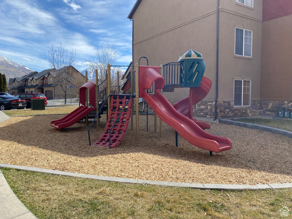 Communal playground featuring a mountain view