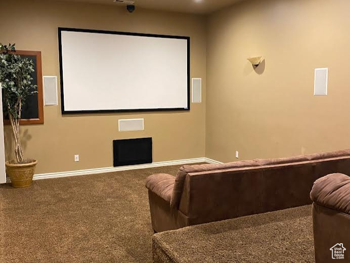 Carpeted cinema room with visible vents, recessed lighting, and baseboards