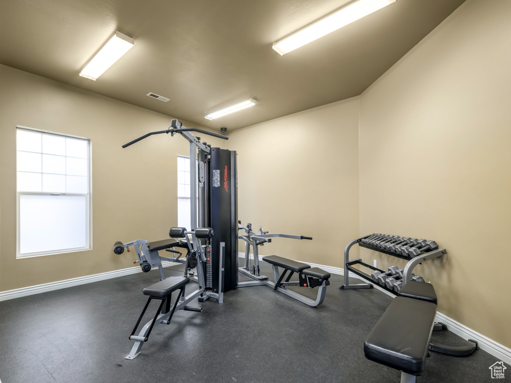 Workout area with baseboards and visible vents