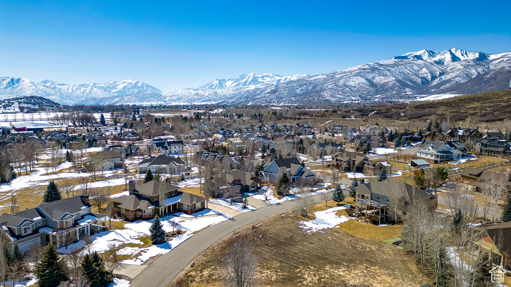 Birds eye view of property with a mountain view and a residential view
