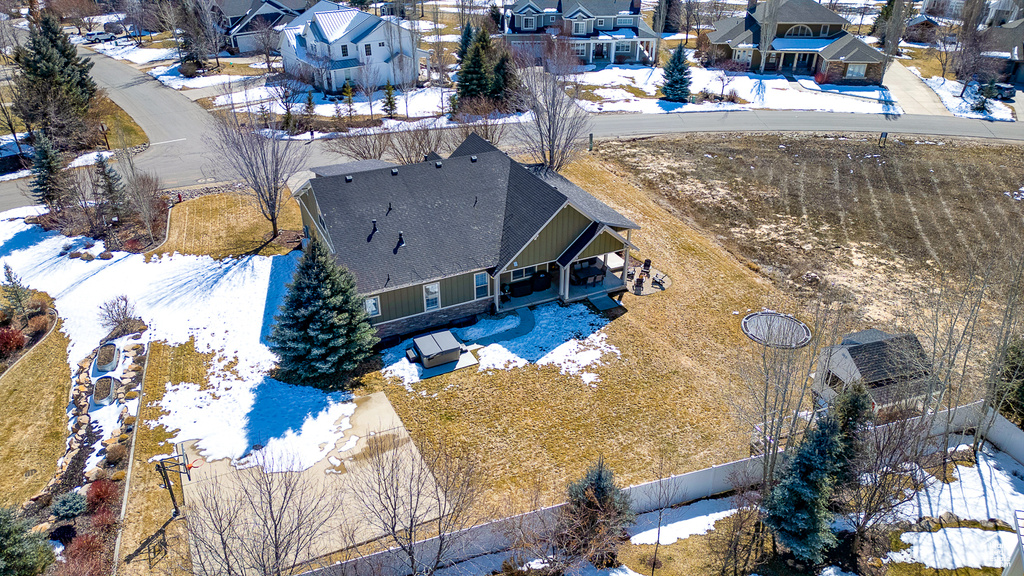 Snowy aerial view with a residential view
