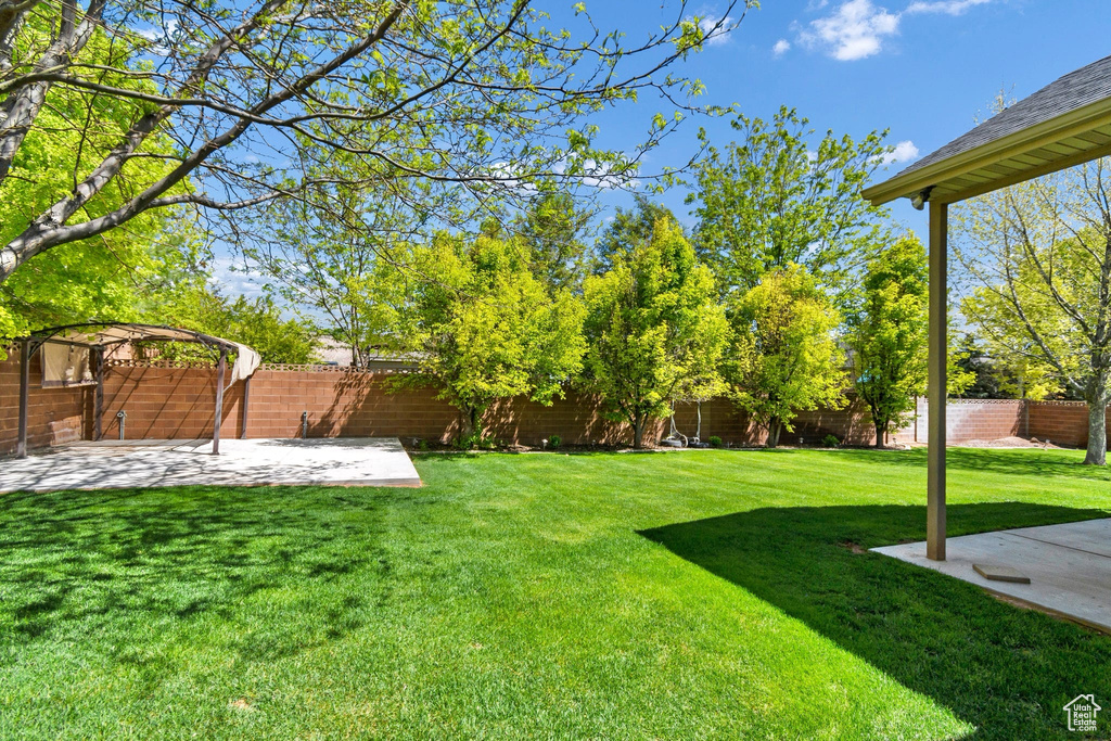 View of yard featuring a patio area and a pergola