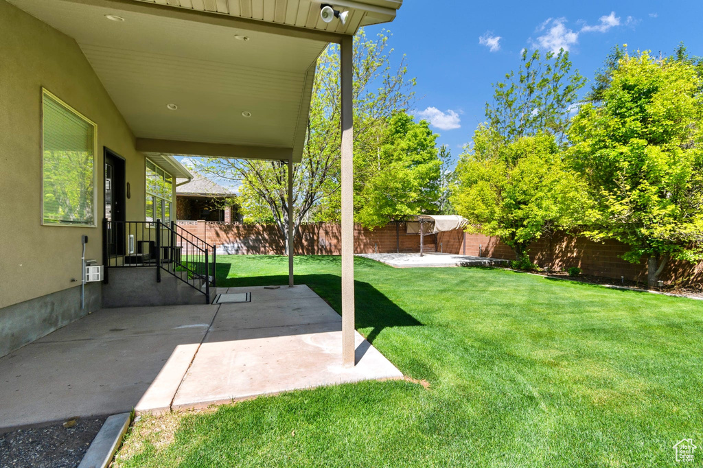 View of yard with a patio