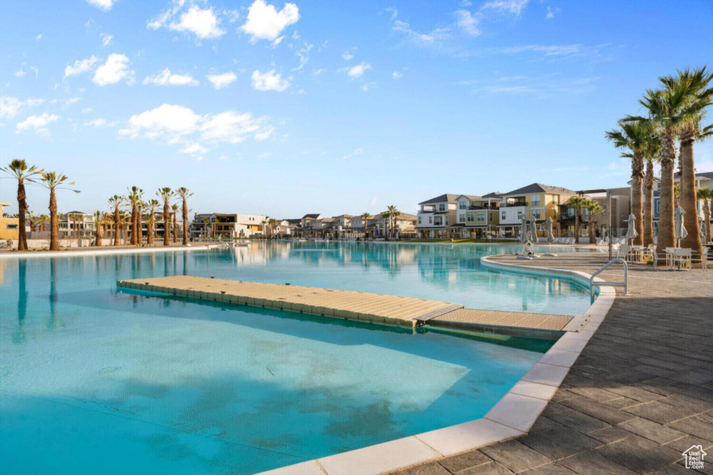 Community pool featuring a residential view