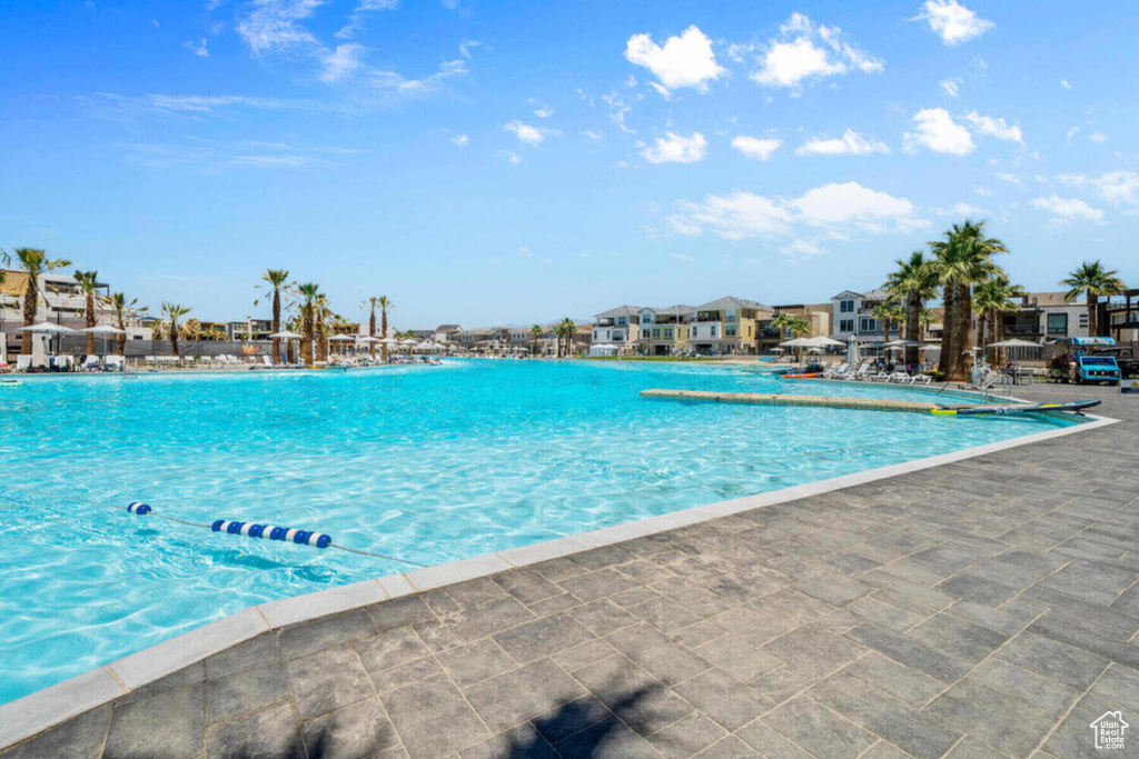 Community pool with a residential view