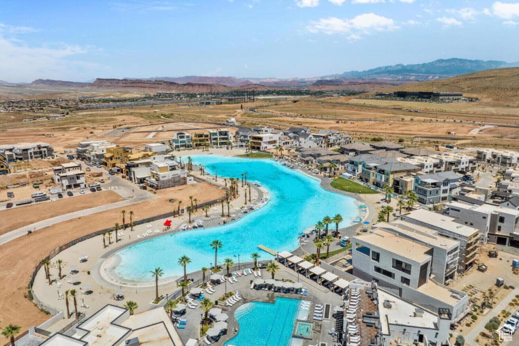 Birds eye view of property with a mountain view