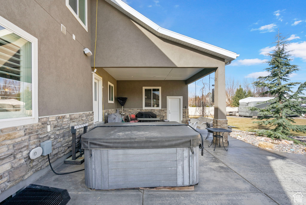 View of patio / terrace featuring a hot tub