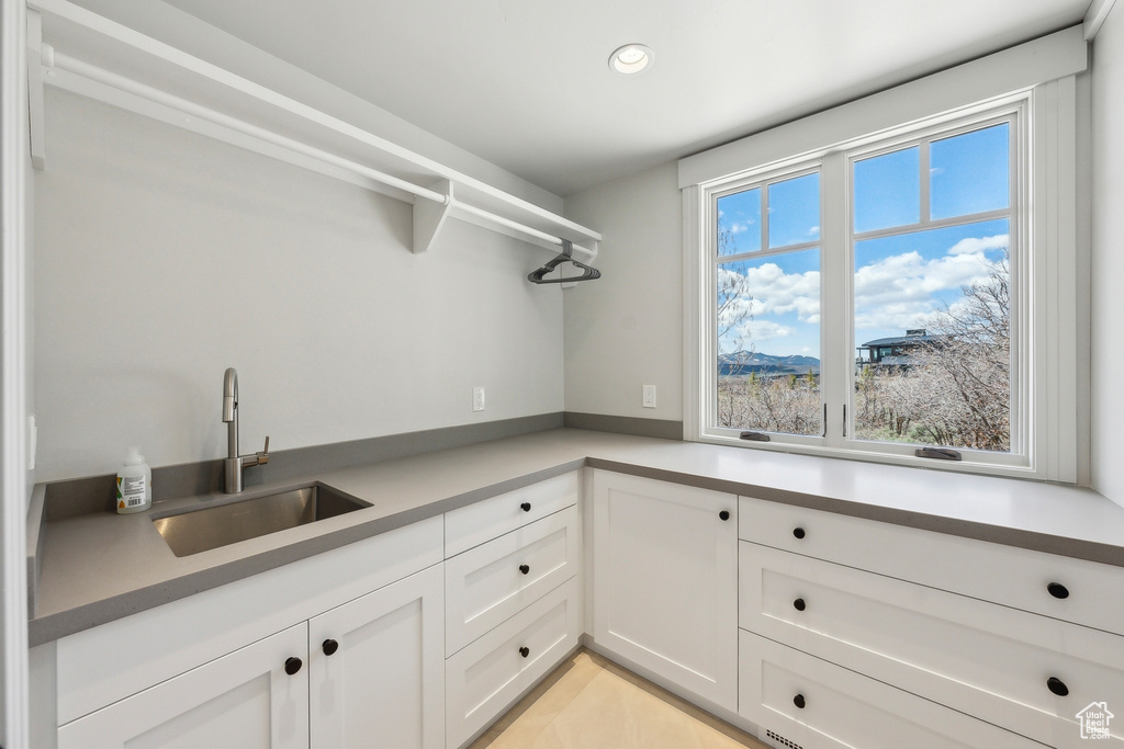 Laundry room featuring recessed lighting and a sink