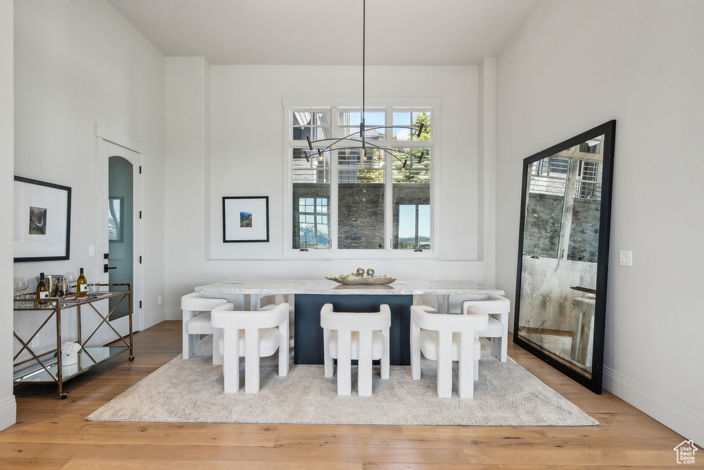 Dining area featuring baseboards and light wood-style flooring