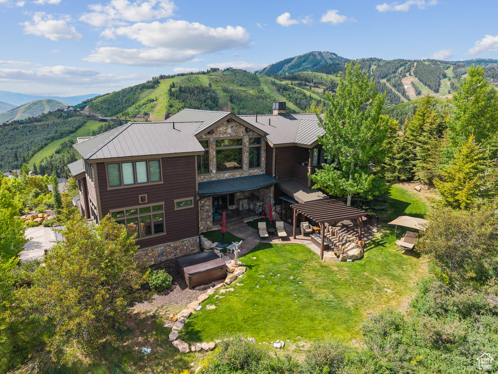 View from above of property with a mountain backdrop