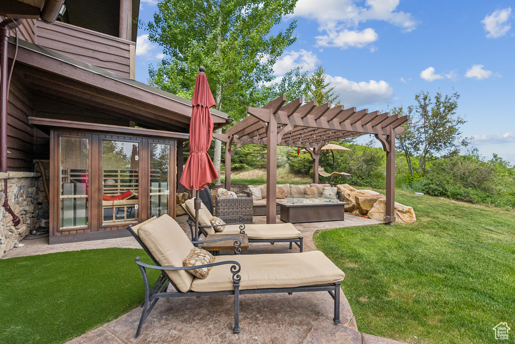 View of patio featuring a pergola and an outdoor living space