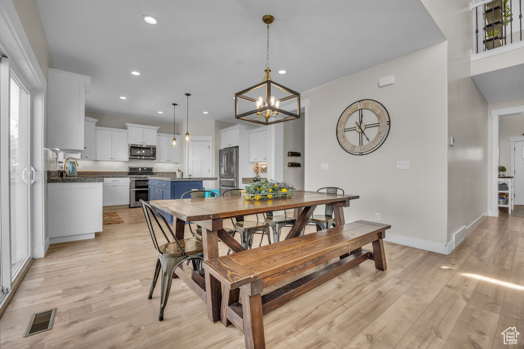 Dining space featuring visible vents, recessed lighting, light wood-type flooring, and baseboards