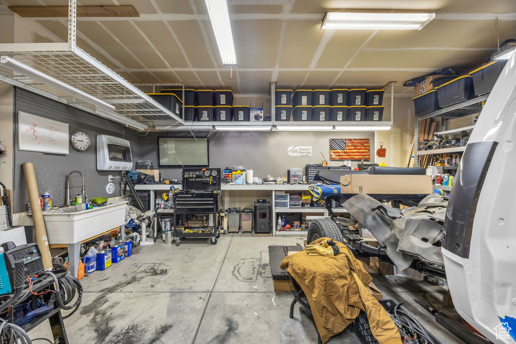 Garage with heating unit and a workshop area