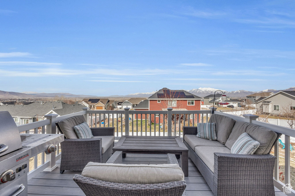 Deck featuring a mountain view, a residential view, and outdoor lounge area