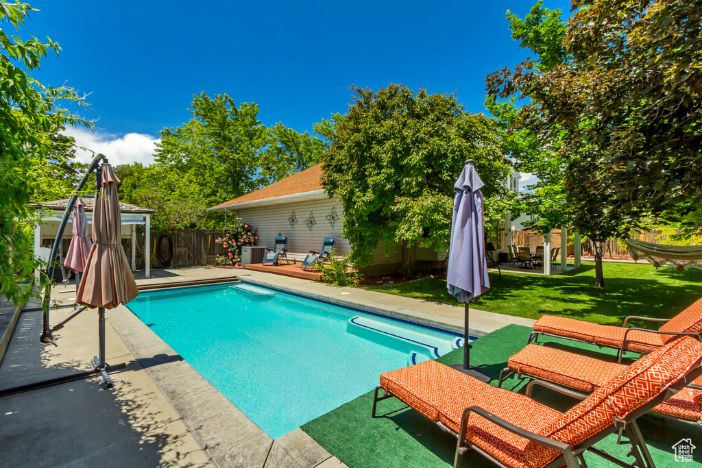 View of swimming pool with a patio area and a gazebo