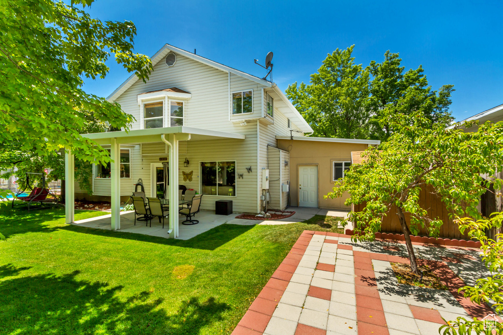 Rear view of house featuring a patio area