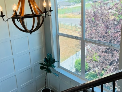 Room details with a decorative wall and a chandelier