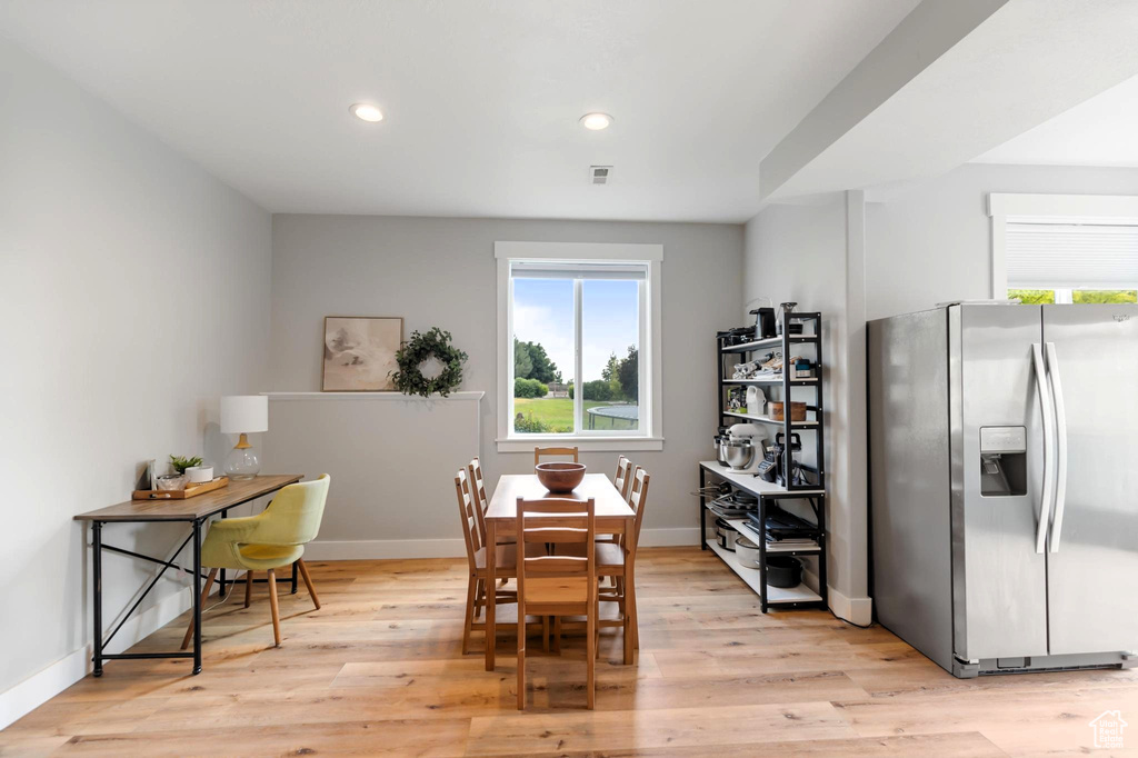 Dining space featuring visible vents, recessed lighting, light wood-style floors, and baseboards