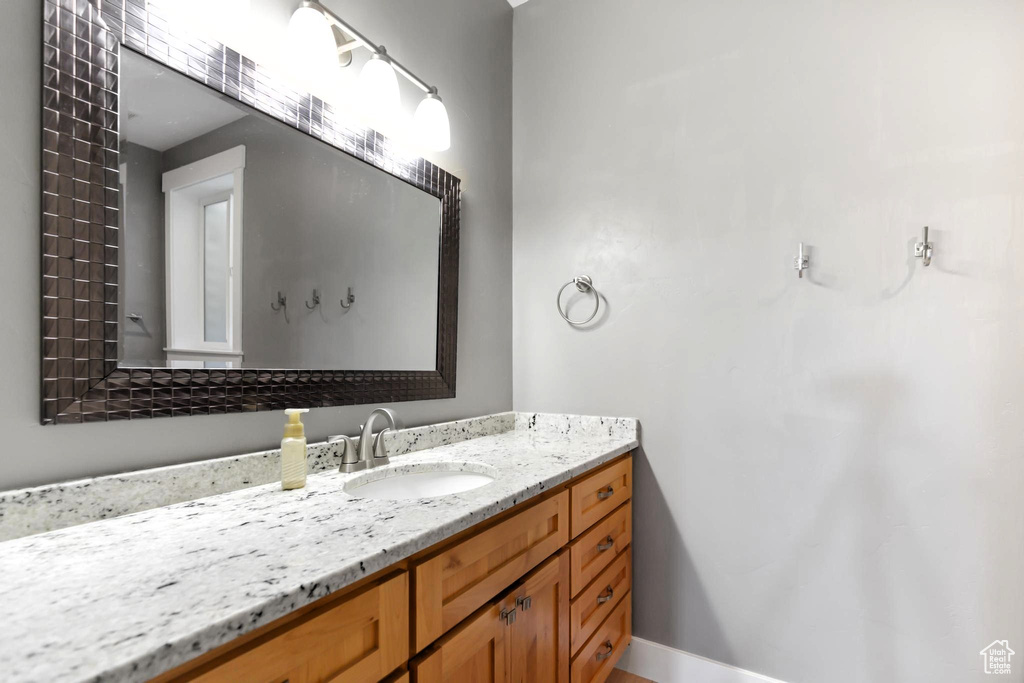 Bathroom with baseboards and vanity