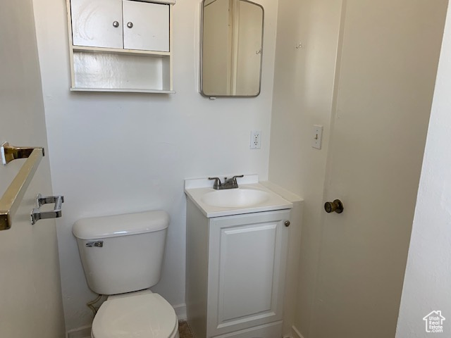 Half bath with toilet and vanity