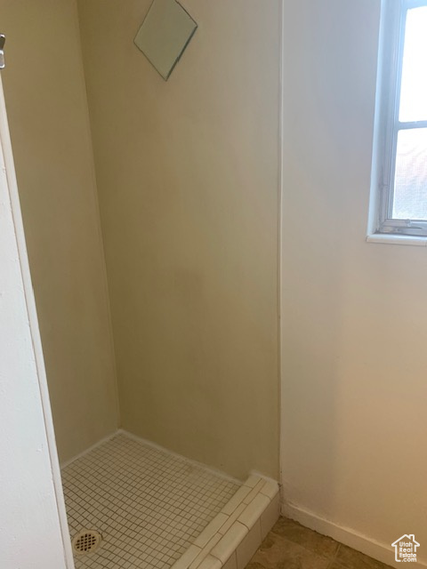 Bathroom featuring tile patterned flooring and baseboards