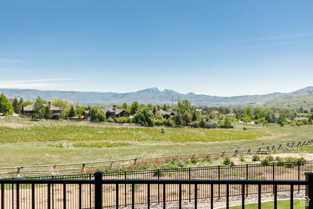 View of mountain backdrop featuring rural landscape