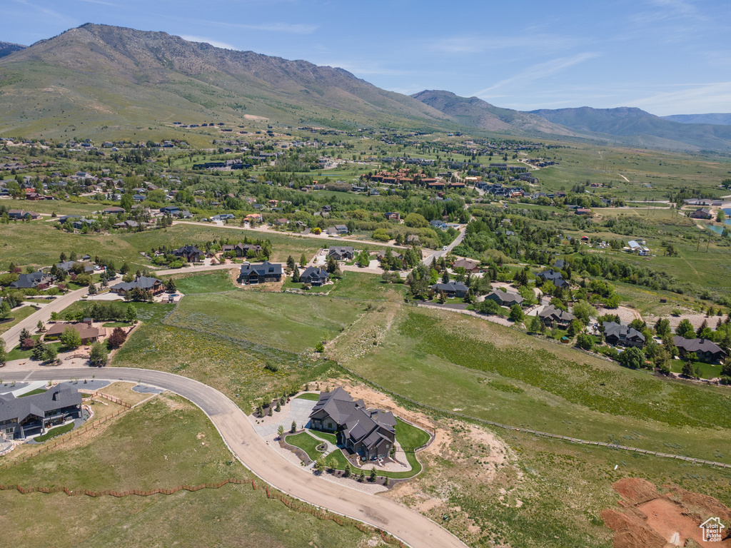Aerial view of property\\\\\\\'s location with a mountain backdrop and nearby suburban area