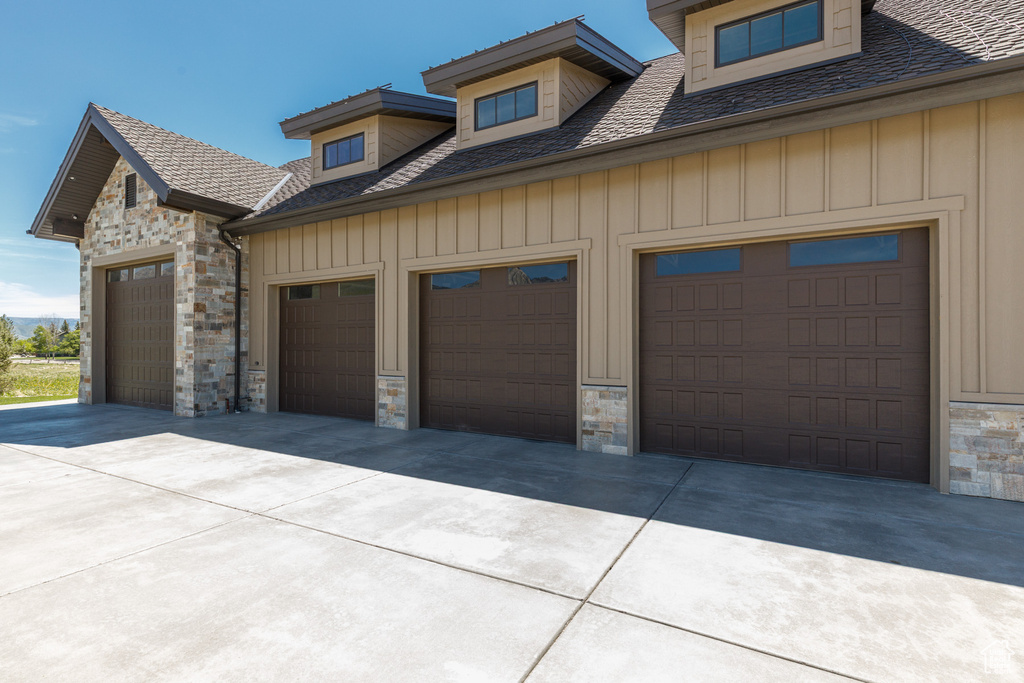 Garage with concrete driveway
