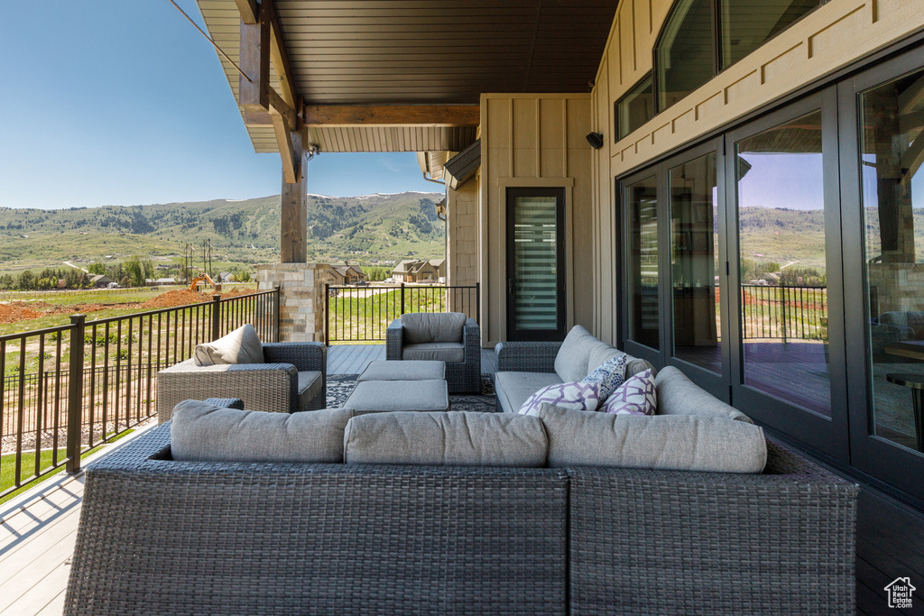 View of patio with a mountain view and outdoor lounge area