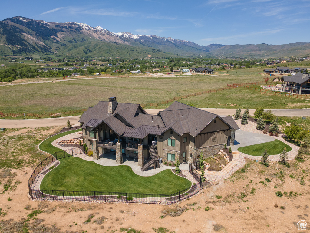 Overview of rural landscape featuring a mountain backdrop