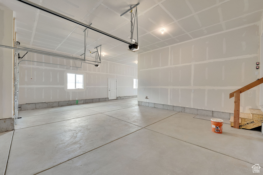 Garage featuring a garage door opener
