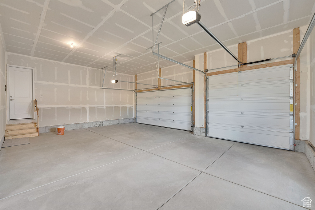 Garage featuring a garage door opener