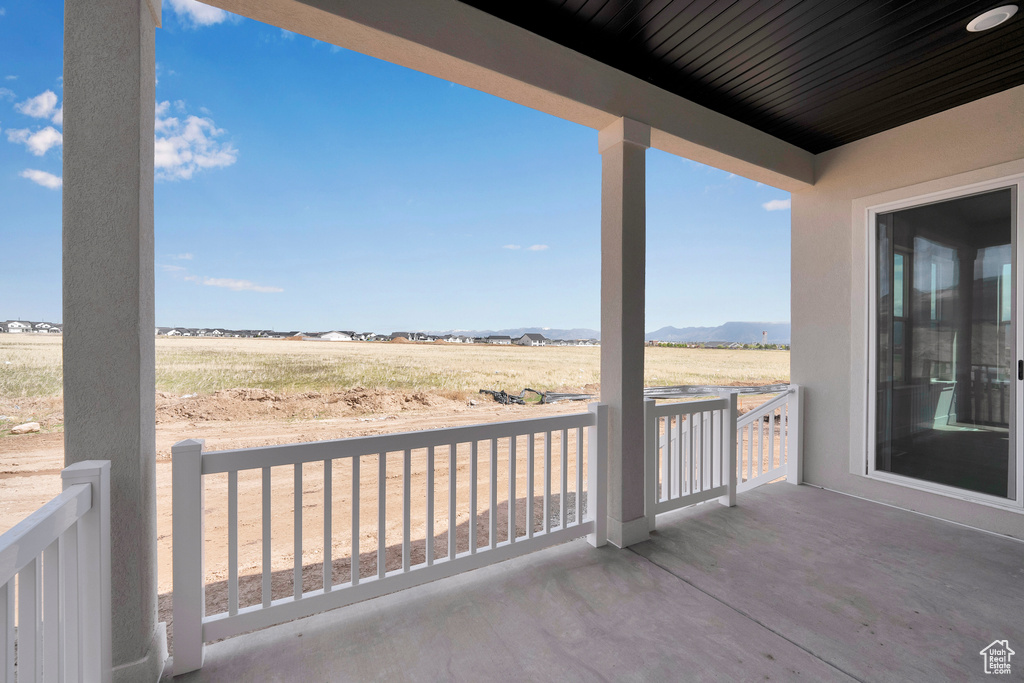 View of patio / terrace featuring a rural view and a mountain view
