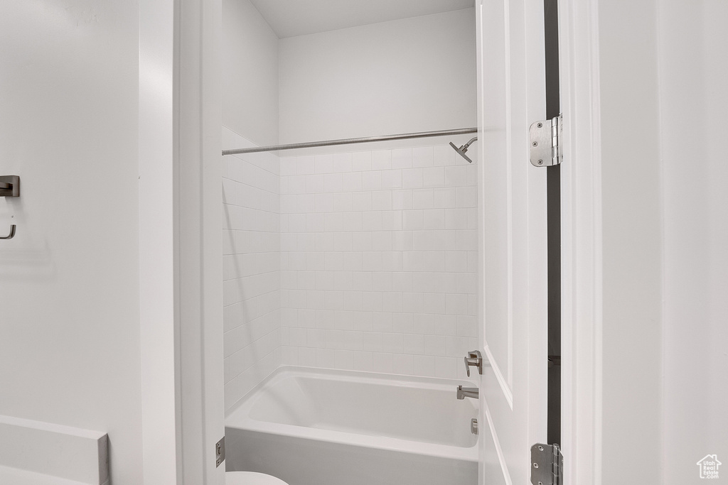 Bathroom featuring shower / washtub combination