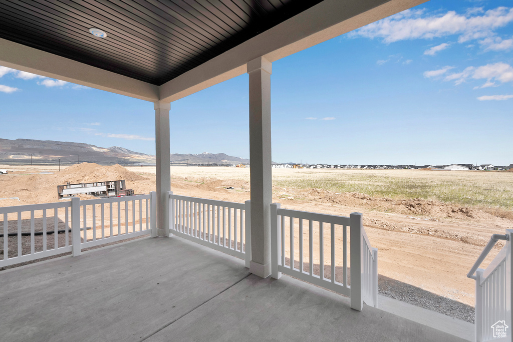 View of patio featuring a mountain view and a rural view