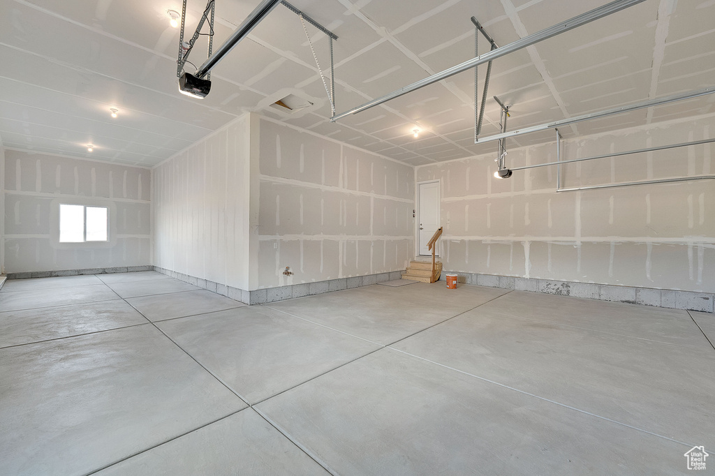 Garage featuring a garage door opener
