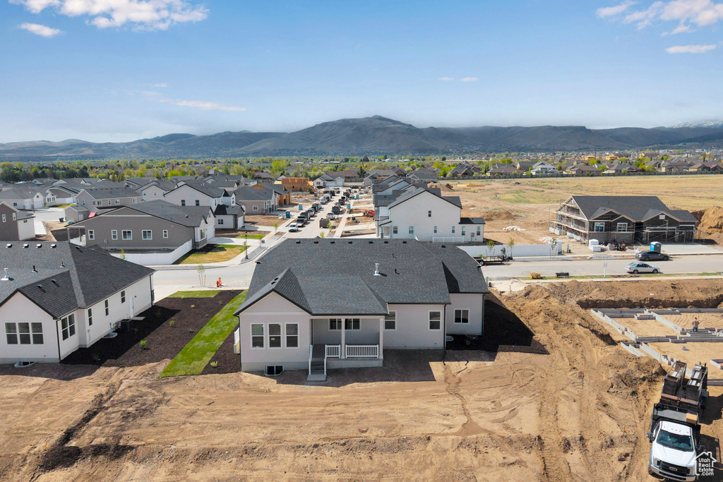 Aerial view of residential area featuring a mountain backdrop
