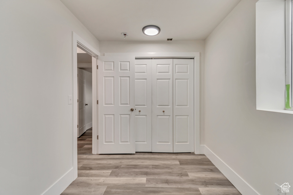 Interior space featuring baseboards and light wood-style floors