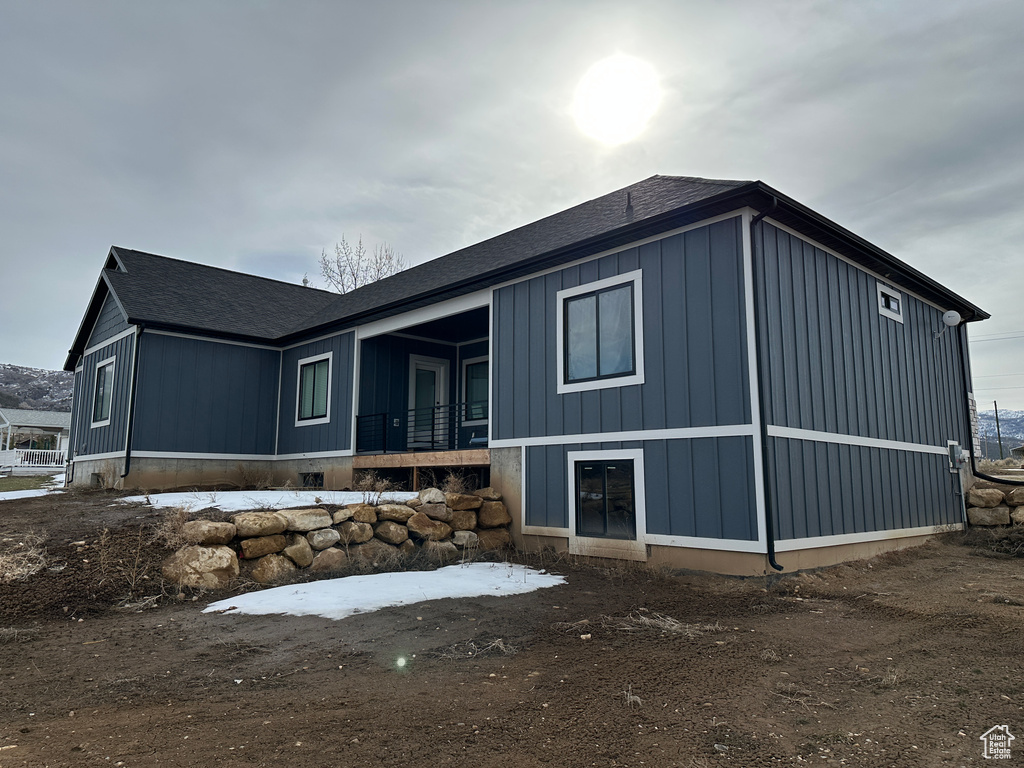 Exterior space featuring roof with shingles