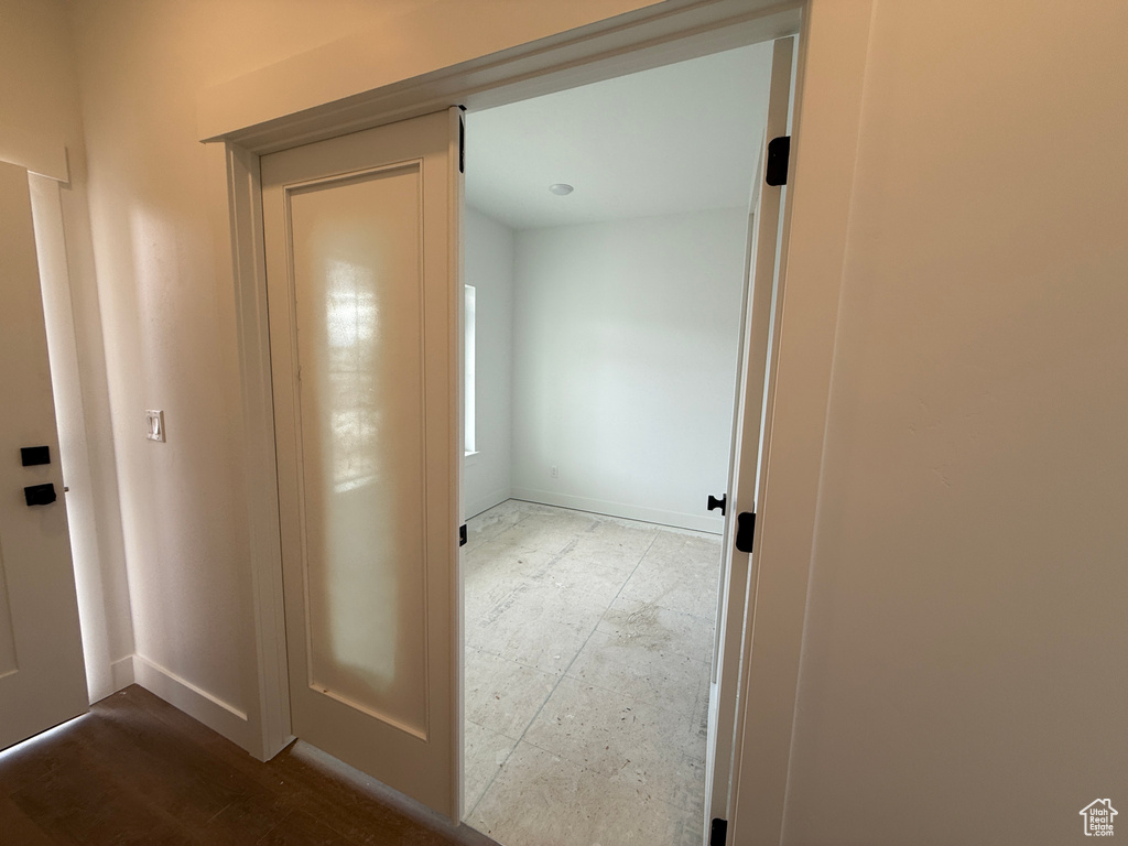Hallway featuring baseboards